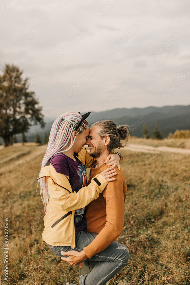 couple in love enjoying each other and walking in the mountains
