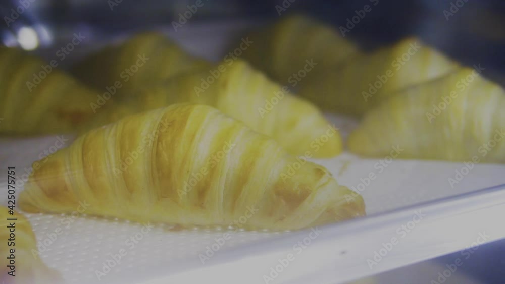 Croissants are baked in the oven. Timelapse. Croissants are baked in the oven. Timelapse.