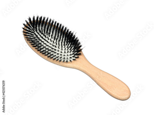 Wooden hair brush isolated on white