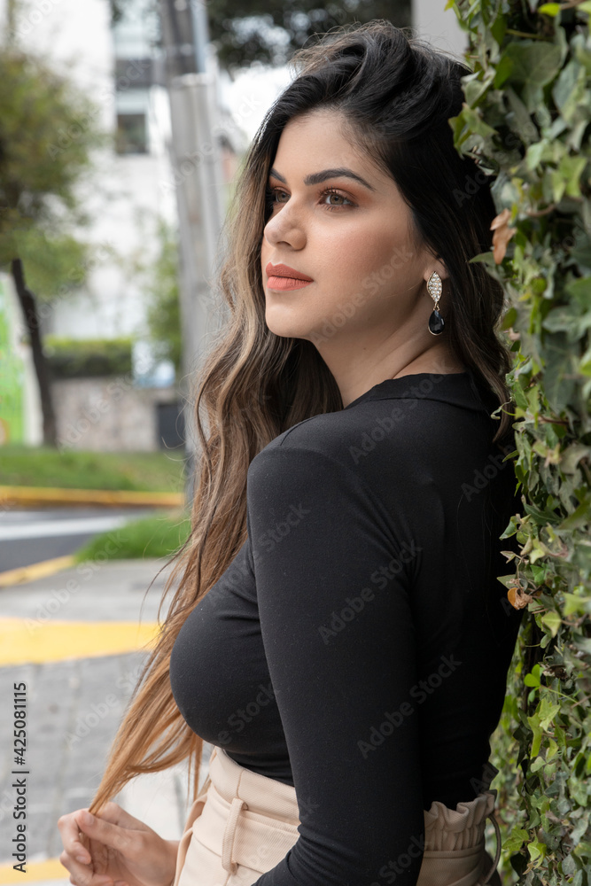 details of the face of a beautiful young woman with long, blond hair, makeup, in the background are some plants, lifestyle with nature details of the face of a beautiful young woman with long, blond hair, makeup, in the background are some plants, lifestyle with nature