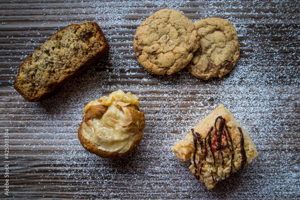 Fototapeta premium Christmas Holiday Dessert care pack with cookies, rice crispy treats, cupcakes, and banana nut bread