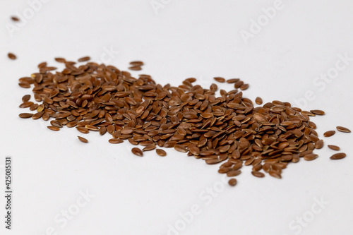 Close-up of flaxseed on a white background. Macro shot of flax seed. 