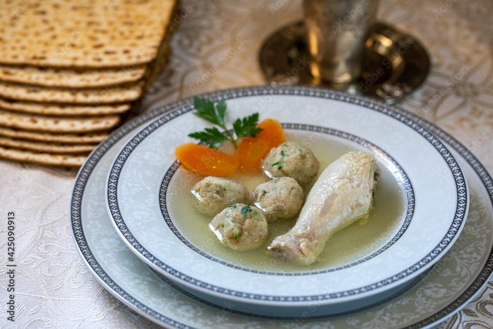 Chicken broth with chicken leg and Kneidlach