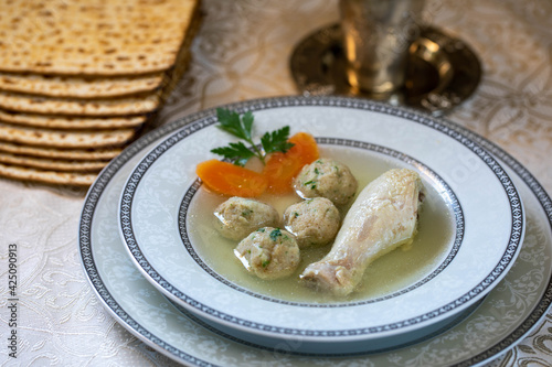 Chicken broth with chicken leg and Kneidlach