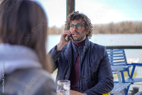 Photography Young handsome businessman talking on mobile phone