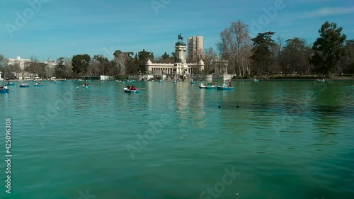Lake of the Retiro Park ( Porque del Retiro )in Madrid with people paddling in boats 