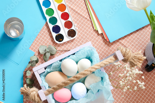 Easter table layout with paints close up. Easter concept. Preparing for the Easter holiday
