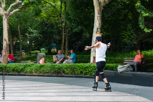 Middle-aged Roller Skater Showing Some Real Technique photo