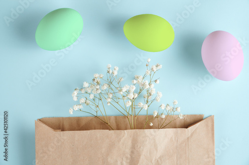 Easter layout. Easter card with envelope and eggs. preparation for Easter. selective focus. blue background 
