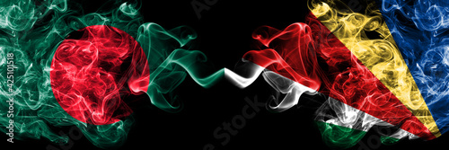 Bangladesh, Bangladeshi vs Seychelles, Seychellois smoky mystic flags placed side by side. Thick colored silky abstract smokes flags.