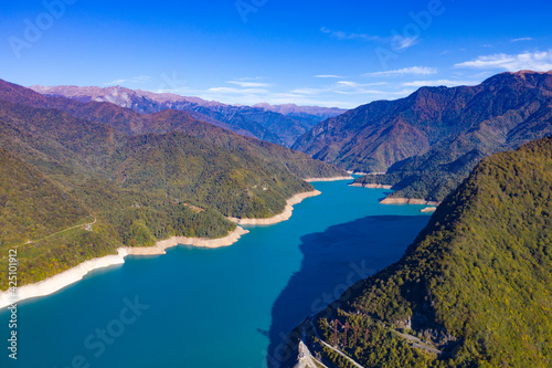 Blue lake surrounded by mountains and forest