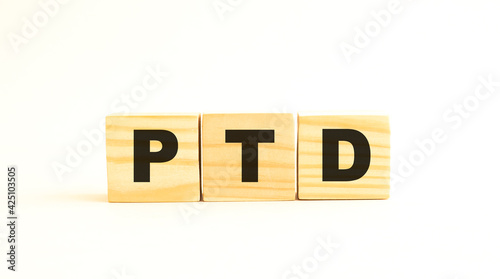 The word PTD. Wooden cubes with letters isolated on white background.