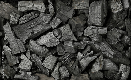 Background texture of many black charcoal pieces photo