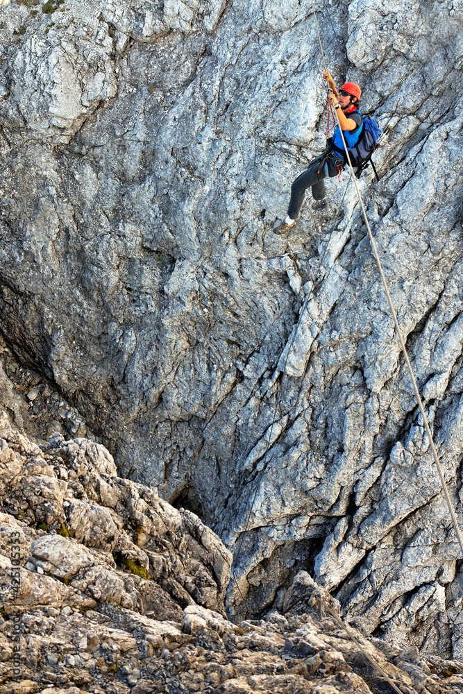 Alpinist climbing on Koenigsjodler Ridge, Austrian Alps, Europe Alpinist climbing on Koenigsjodler Ridge, Austrian Alps, Europe