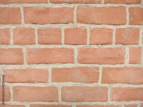 Red brick wall neat masonry clean concrete streaks 