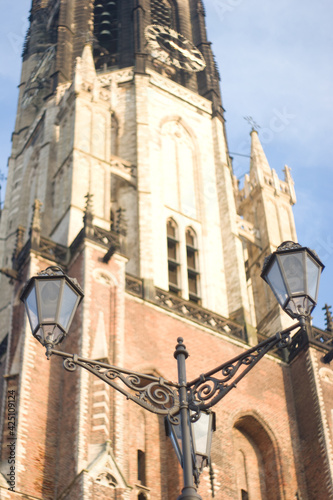 Tower with street lights of Nieuwekerk Nieuwe Kerk in Delft (The Netherlands) photo