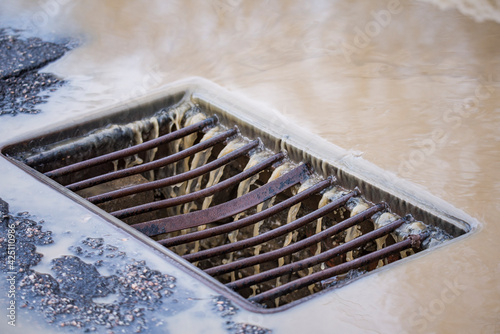 storm drain grate large on the road
