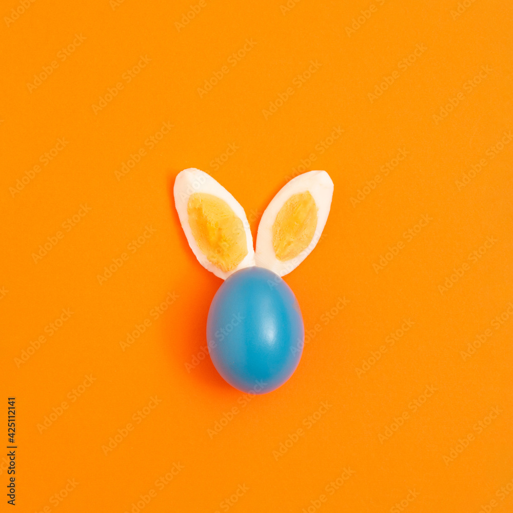 Beautiful bunny from Easter eggs on a yellow background. Flat lay creative composition. 2021 Beautiful bunny from Easter eggs on a yellow background. Flat lay creative composition. 2021