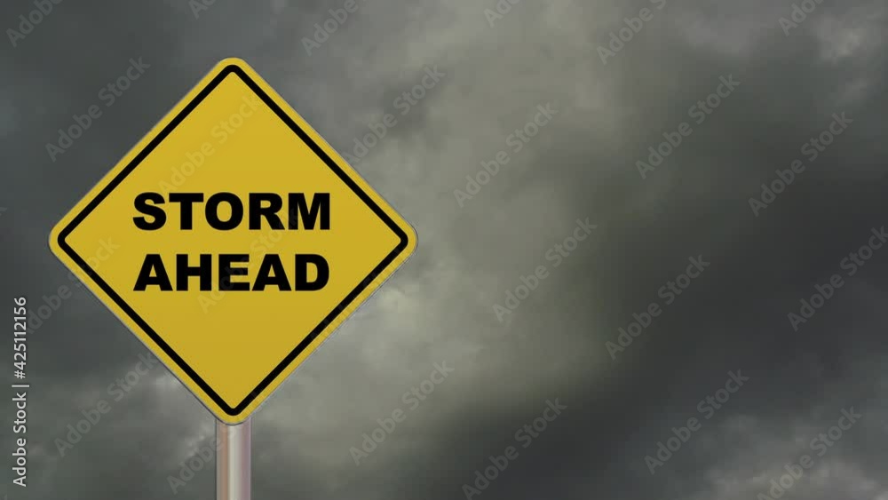 Time lapse of a diamond-shaped crossing sign with yellow background and black border with a short phrase saying “Storm Ahead” in the middle. Time lapse of a diamond-shaped crossing sign with yellow background and black border with a short phrase saying “Storm Ahead” in the middle.