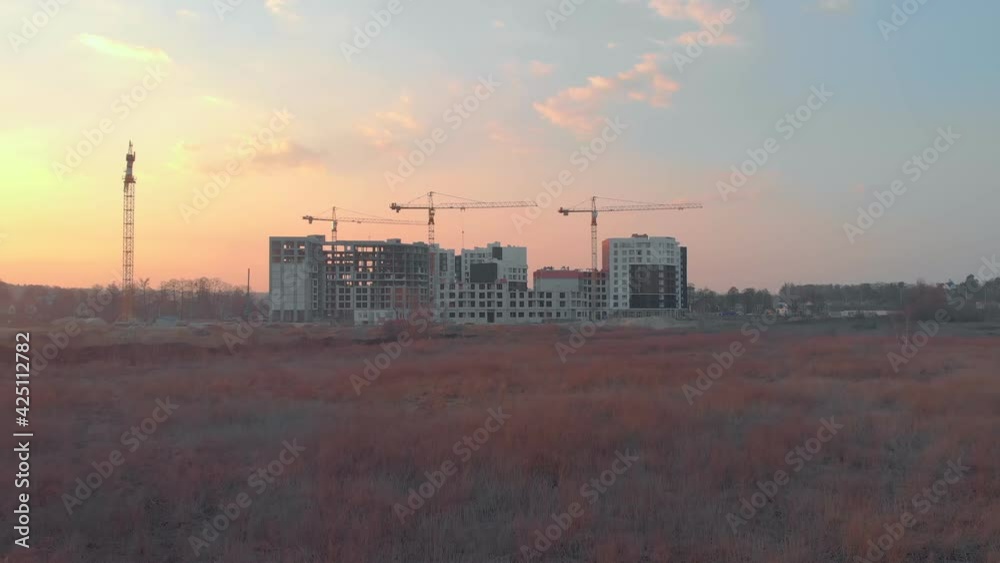 Aerial construction apartment buildings drone view on sunset Aerial construction apartment buildings drone view on sunset