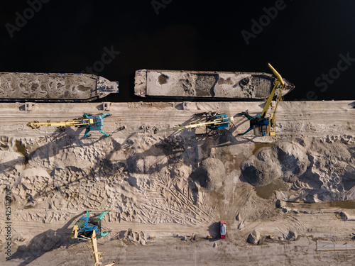 Aerial view of river cargo crane for loading sand onto a barge