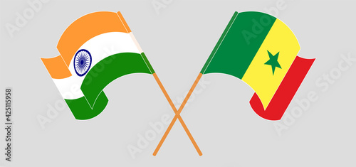 Crossed and waving flags of India and Senegal
