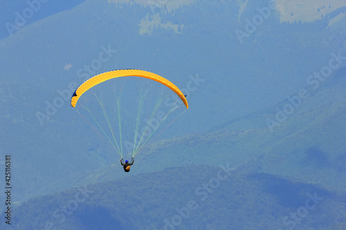 Paraglider prepareing to take off from a mountain