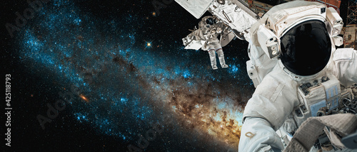 Fototapeta Naklejka Na Ścianę i Meble -  Astronaut spaceman do spacewalk while working for space station in outer space . Astronaut wear full spacesuit for space operation . Elements of this image furnished by NASA space astronaut photos.