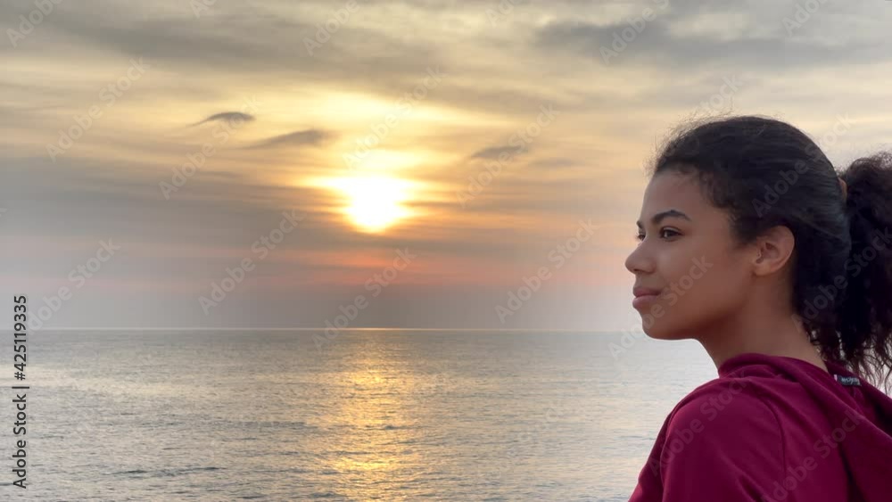Set your mind free. The camera close up young woman who dreams of something pleasant, standing with her eyes closed then she opens them. Slow motion. Copy space on the left side Set your mind free. The camera close up young woman who dreams of something pleasant, standing with her eyes closed then she opens them. Slow motion. Copy space on the left side