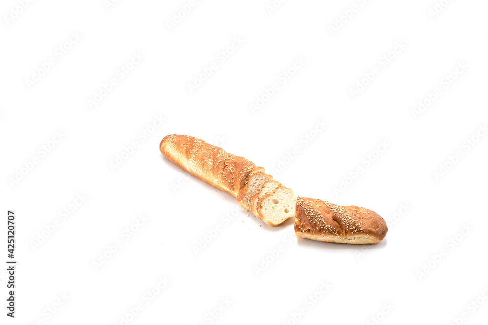 Baguette with sesame seeds cut into small pieces on a white background Baguette with sesame seeds cut into small pieces on a white background