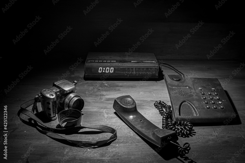 Black and white retro,vintage photograph of a radio next to an old ...