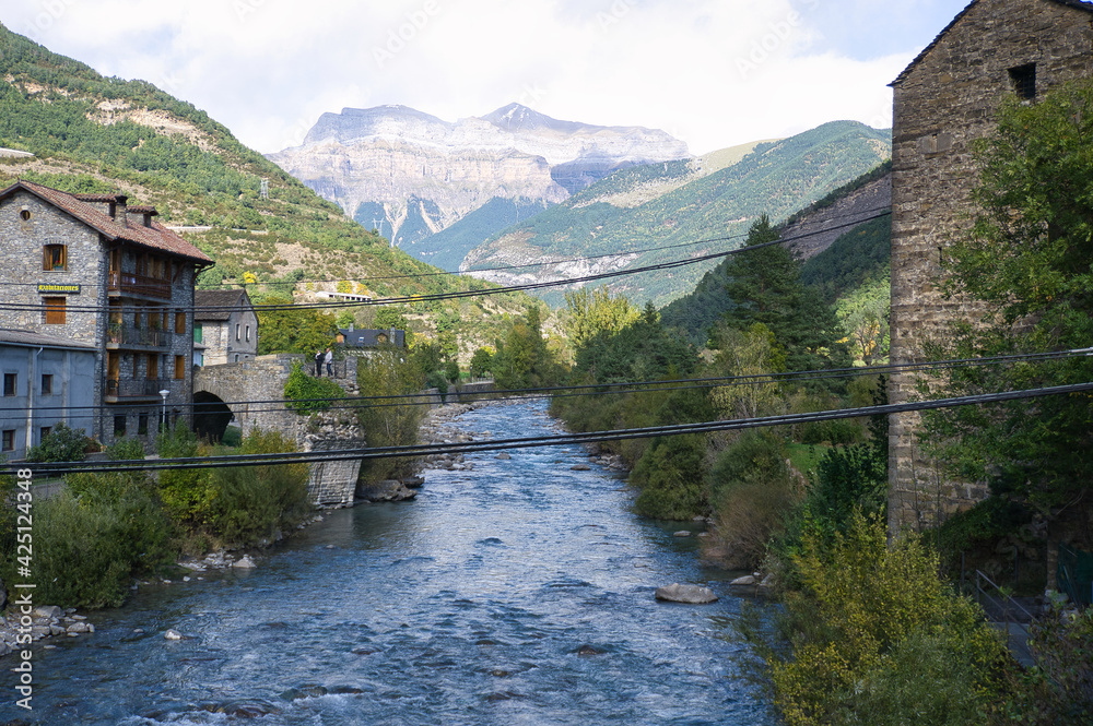 the Ara river as it passes through the town of Broto, in the Aragonese Pyrenees, located in Huesca, Spain