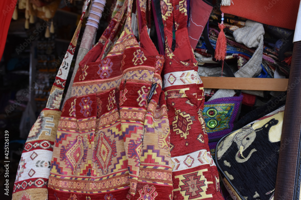 Saddlebags made with traditional turkey patterns are on display at the market