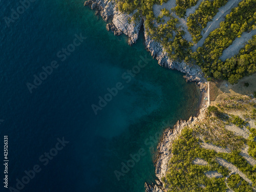 Little beach at croatia coastline in summer light and blue water