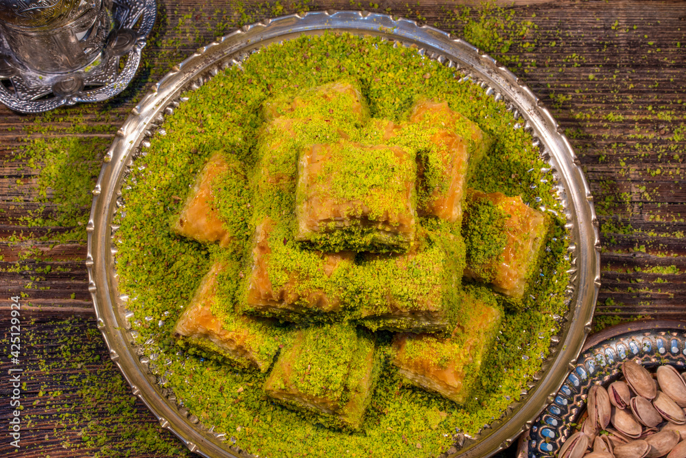 Traditional Turkish Ramadan dessert - baklava with pistachios (Turkish: fistikli baklava). Eid mubarak.  Ramazan bayrami. Ramadan kareem.