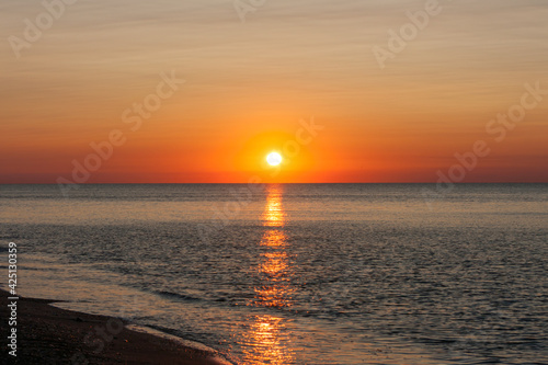 Fototapeta Naklejka Na Ścianę i Meble -  Seascape after sunrise with reflection of the sun track