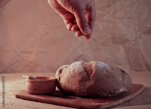 Round loaf bread with some slices cut