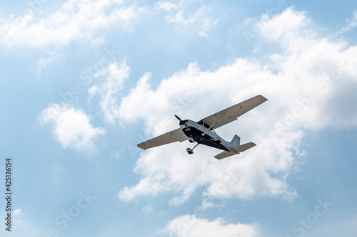 Ground view of a small plane flying