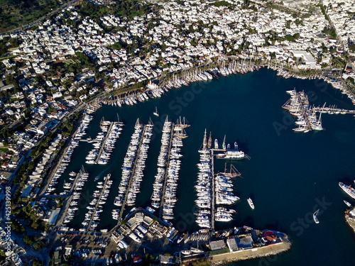 Amazing panoramic view from drone of beautiful full of yachts Bodrum harbour and ancient Kalesi castle in Mugla province in Turkey 