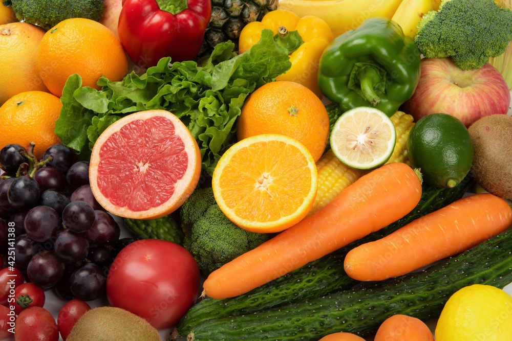Assorted fresh ripe fruits and vegetables. Food concept background.