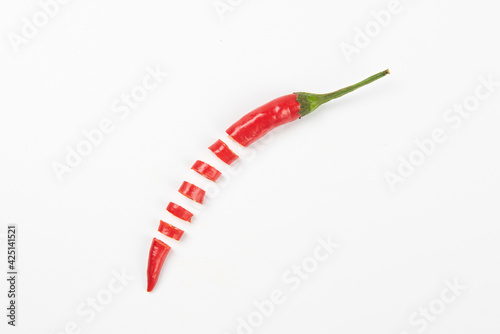 Slice of red hot little chili pepper pattern isolated on white background