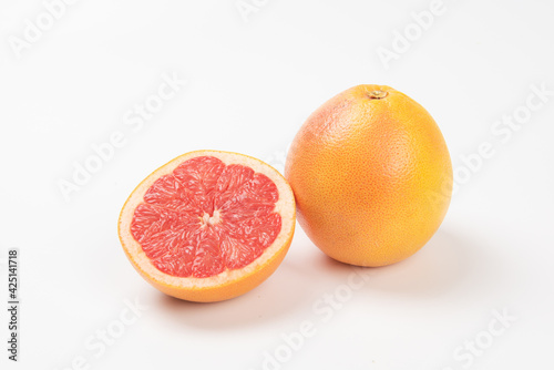 grapefruit slice, half cut grapefruit on white background.