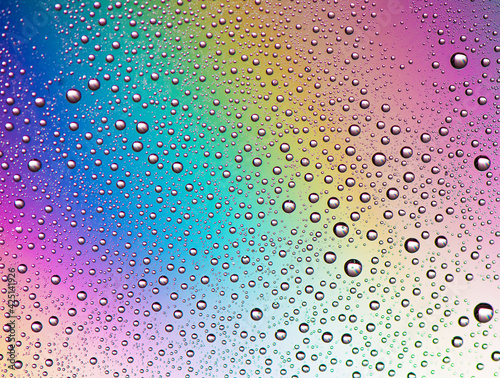 Droplets on a rainbow background