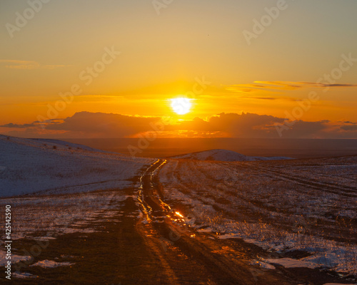 Sunset view of countryside road in spring  Shengeldy  Kazakhstan