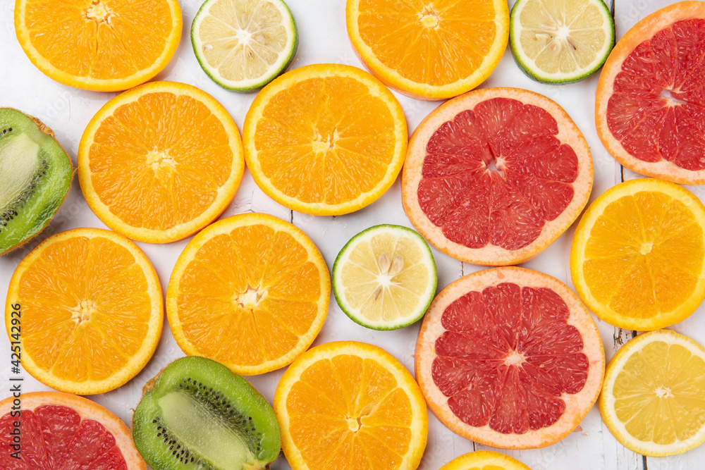 sliced of fresh fruits . orange and grapefruit .Food concept background. sliced of fresh fruits . orange and grapefruit .Food concept background.