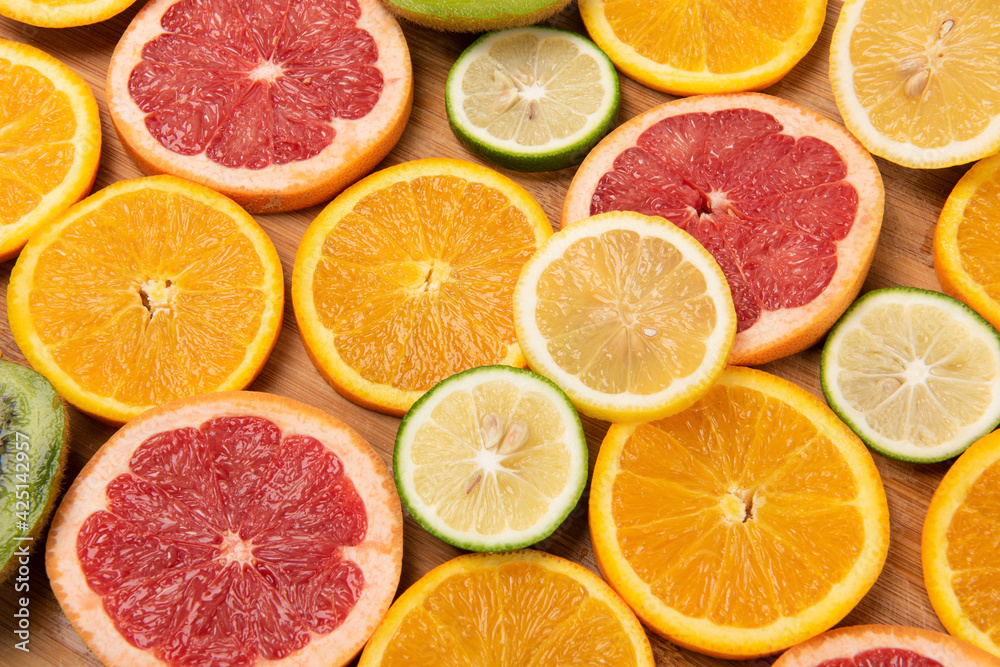sliced of fresh fruits . orange and grapefruit .Food concept background. sliced of fresh fruits . orange and grapefruit .Food concept background.