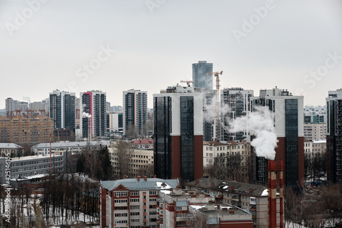 View from above of the houses of Sibirskiy Trakt street in Kazan City. Early spring. Cloudy weather. Selective Focus photo