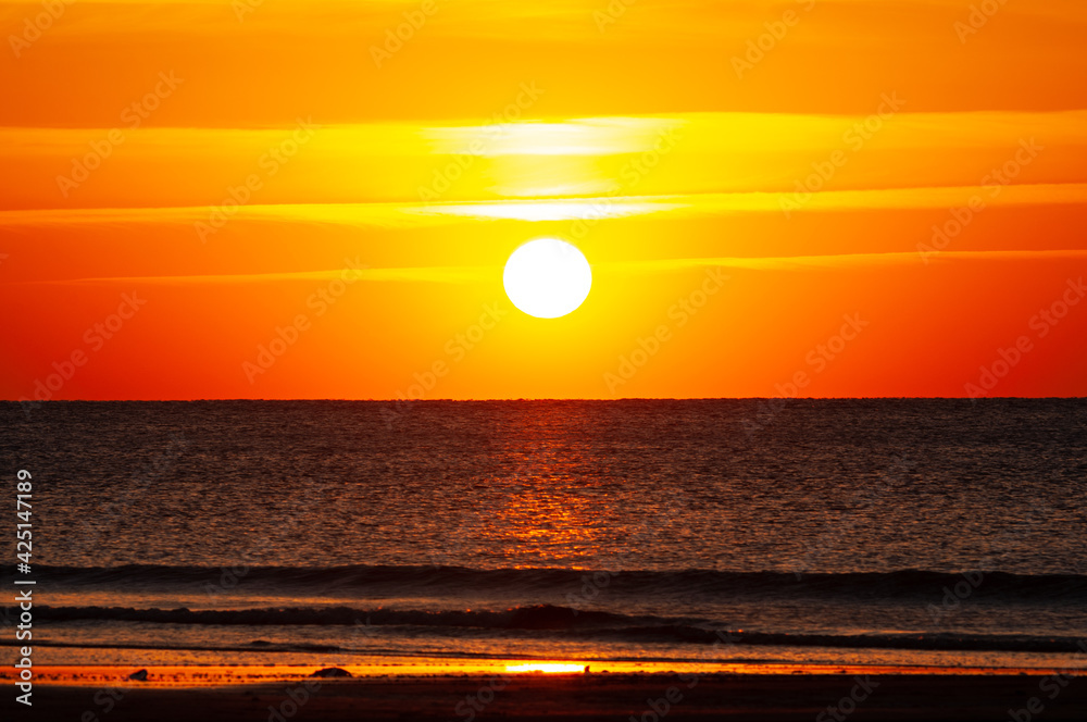 Beautiful sunset on the ocean. orange sky California, April 2021