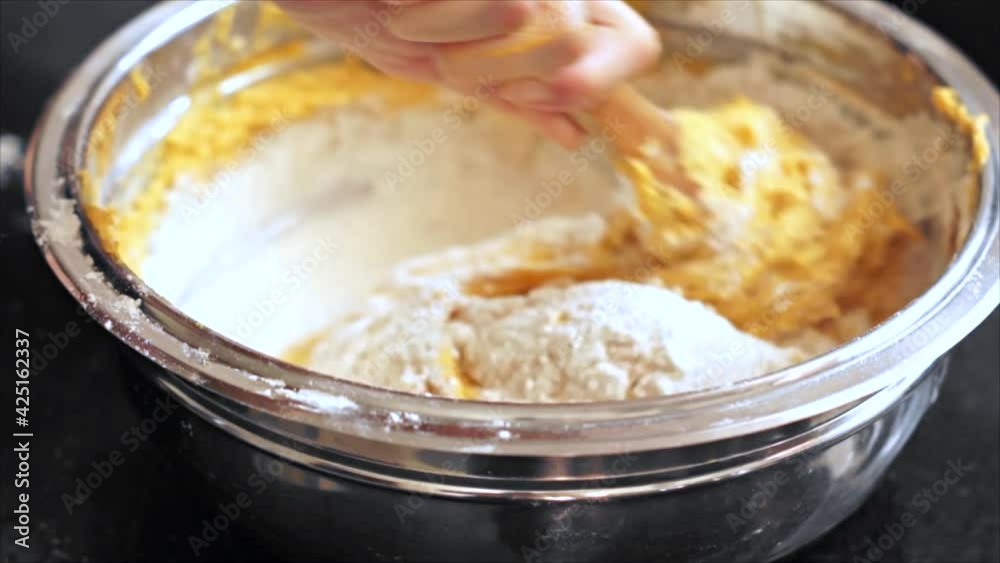 Preparing and mixing the dough. Made with carrots, eggs, flour and biological yeast. Preparing and mixing the dough. Made with carrots, eggs, flour and biological yeast.