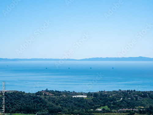 Channel Islands, Pacific Ocean, Santa Barbara Channel and offshore oil rigs as seen from Old Romero Canyon Trail in Montecito, California near Santa Barbara on a clear, sunny spring day